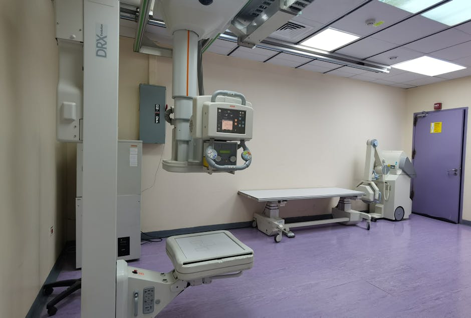 pexels photo 7617601 7617601 Interior view of a well-equipped hospital X-ray room with medical imaging devices.